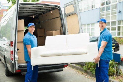 Man with van loading household items in Finchley