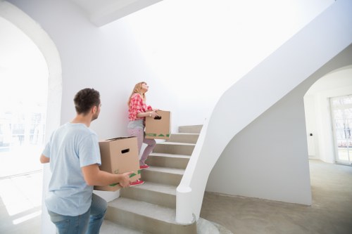 Piano movers planning access and stairs for a Finchley property