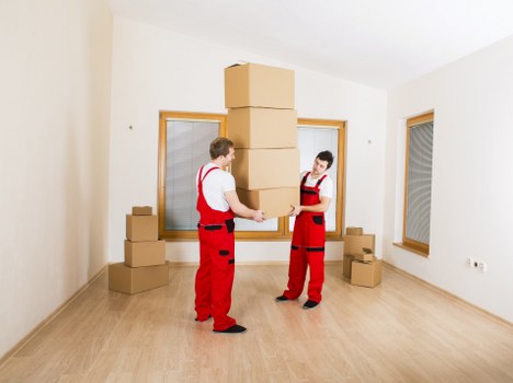 Professional movers loading household items in Finchley